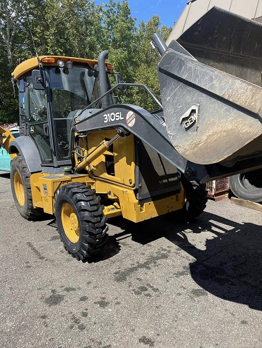 backhoe after having new tires installed